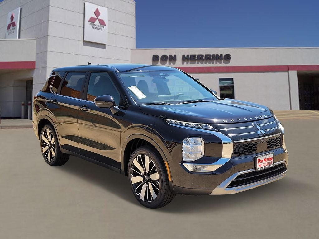 2026 Mitsubishi Outlander SE in Labrador Black Pearl — front three-quarter view