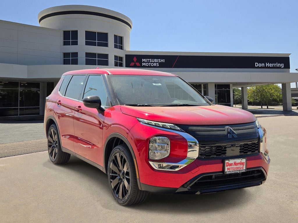 2026 Mitsubishi Outlander LE in Red Diamond — front three-quarter view